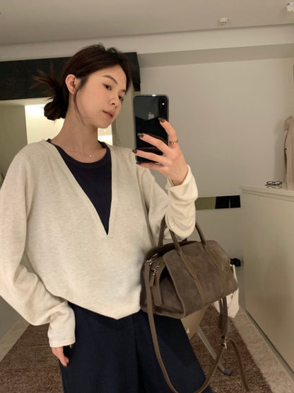 *   Layered V-Neck Knit